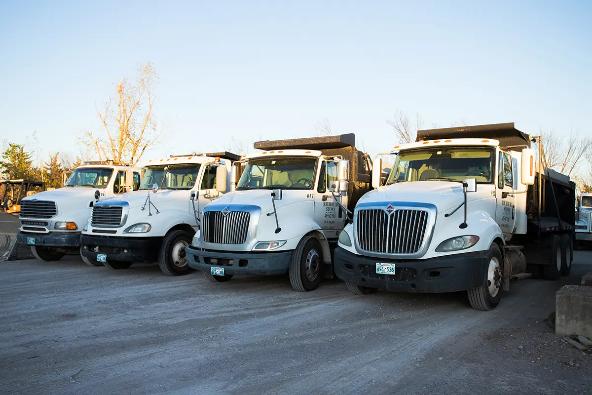 Trucks in a stone yard